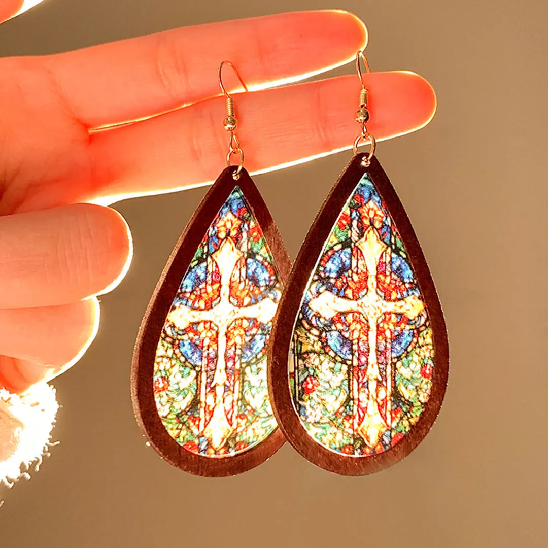 Add a touch of bohemian charm with these vintage-inspired teardrop earrings, featuring a colorful stained-glass design. Lightweight yet eye-catching, they flatter the face and elevate any outfit with effortless elegance.