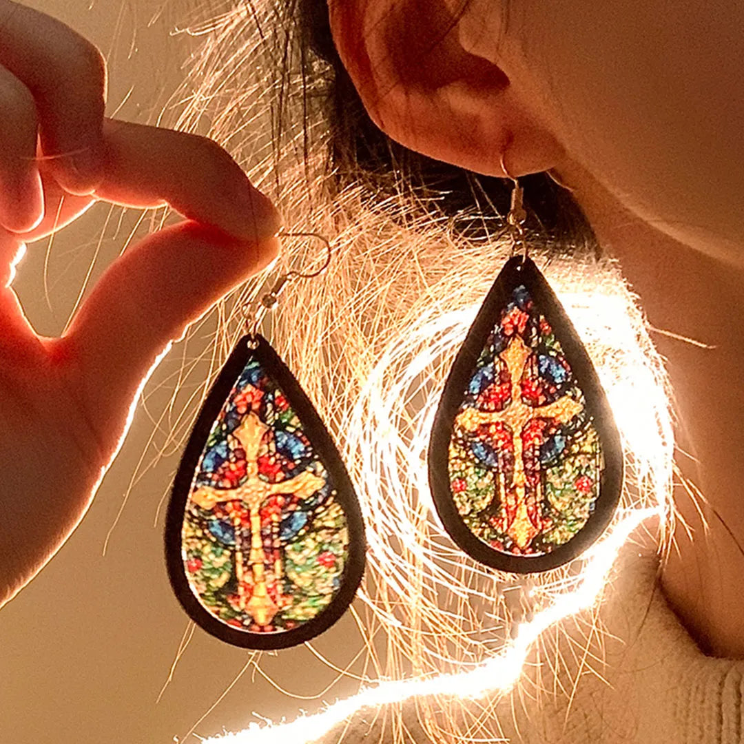 Add a touch of bohemian charm with these vintage-inspired teardrop earrings, featuring a colorful stained-glass design. Lightweight yet eye-catching, they flatter the face and elevate any outfit with effortless elegance.