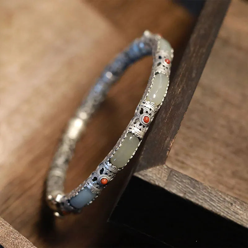 Embrace timeless beauty with this vintage-style Hetian jade bangle, handcrafted for women with a secure 925 sterling silver clasp. A perfect blend of traditional Chinese artistry and modern elegance — ideal for gifting or personal wear.